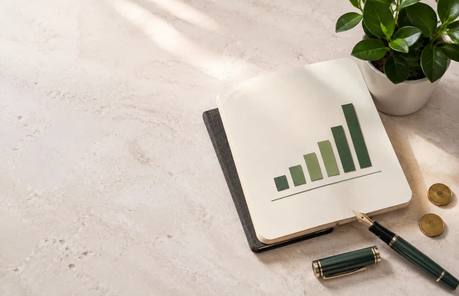 Investment planning desk with a rising green chart